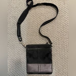 Black and silver cross body coach purse